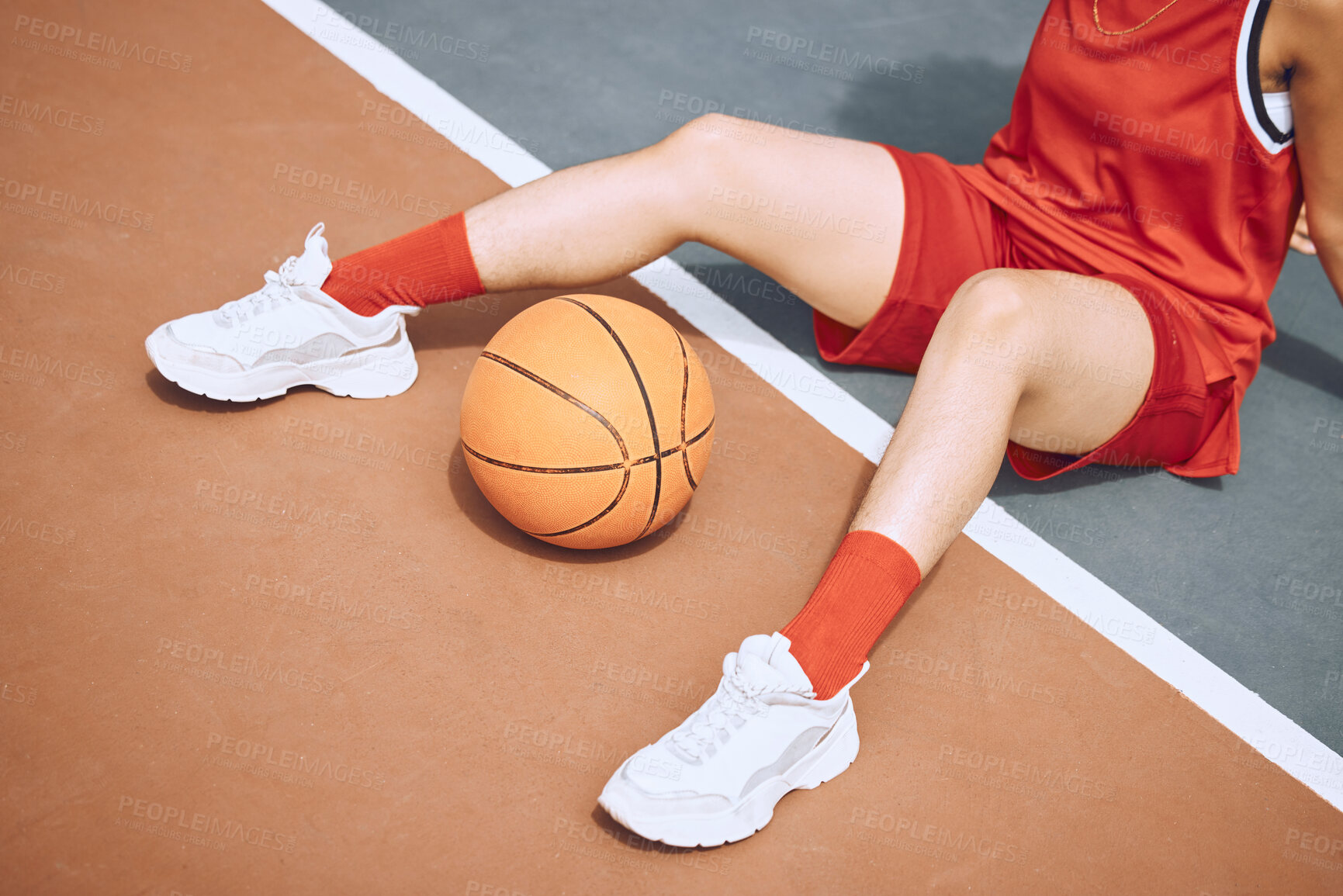 Buy stock photo Fitness, sports and woman on basketball court floor for a break after playing a game alone in the summer. Fashion, cool and healthy athlete on the ground after training, wellness and cardio exercise