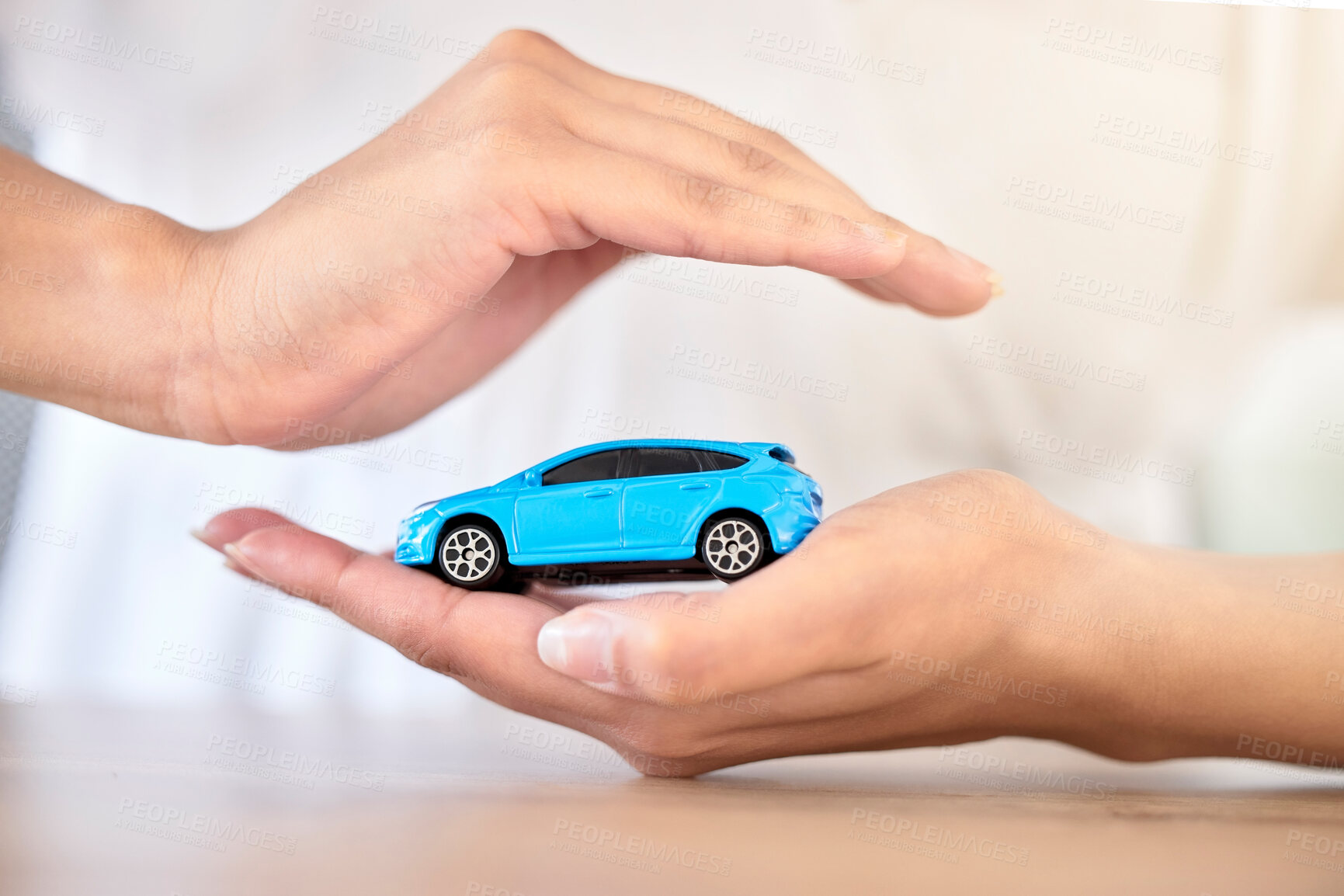 Buy stock photo Car insurance, finance and travel safety model size motor vehicle covered, security and protected by hands. Financial, toy automobile and transportation loan assurance for trustworthy service help