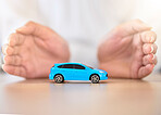 Hands, car and insurance with a business employee covering transport with her hands in her company office. Finance, saving and transportation with a broker offering to secure your vehicle at work