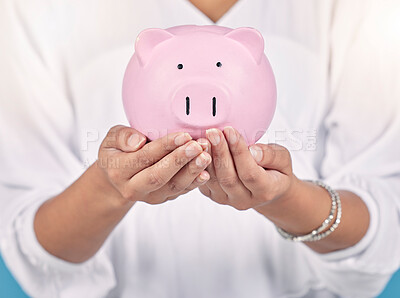 Buy stock photo Piggybank, future investment and money in hands of female bank manager doing finance planning. Closeup of an accountant holding cash savings. Woman with a financial growth budget during inflation.