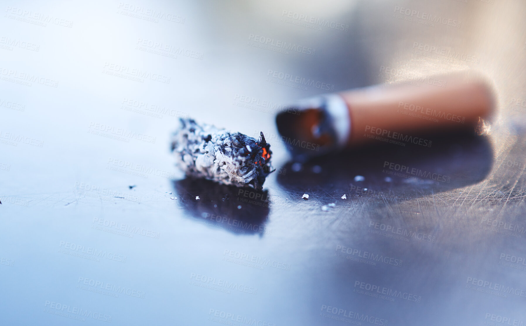 Buy stock photo Smoke, ash and burning cigarette butt on table, tobacco addiction awareness and prevention of risk of lung cancer, illness and danger of death. Stop smoking for better health, lifestyle and energy.