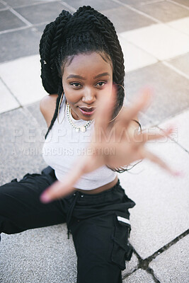 Fashion, stylish and black woman in the city street with urban designer clothes from above. Face portrait of a young, trendy and cool African girl model with style, vision and creativity in the road