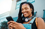 Black woman with a phone in the city, search for online podcast or radio, happy looking for music to listen to. Freedom, relax and smile by African American female enjoying free time and streaming