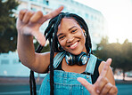 Hands frame, city portrait and black woman with headphones for music during travel holiday in Italy. Happy, and young African girl with perspective, inspiration and vision on fun vacation in summer