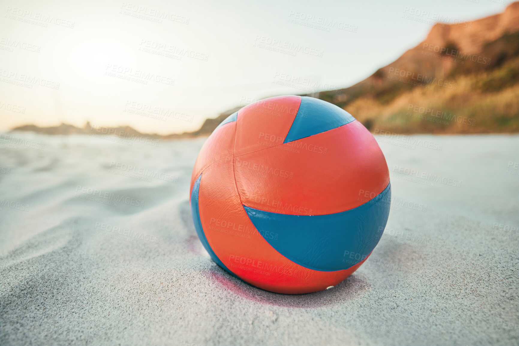 Buy stock photo Beach, ball and volleyball on sand, a game at sunset at tropical ocean destination. Fitness, fun and summer sports at the sea in the evening. White sandy coast, a volley ball and an empty seascape.