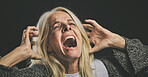 Screaming senior woman, mental health and depression from bipolar anxiety, stress and scary fear on black background. Schizophrenia, psychology and crazy person shout, drugs problem and epilepsy risk
