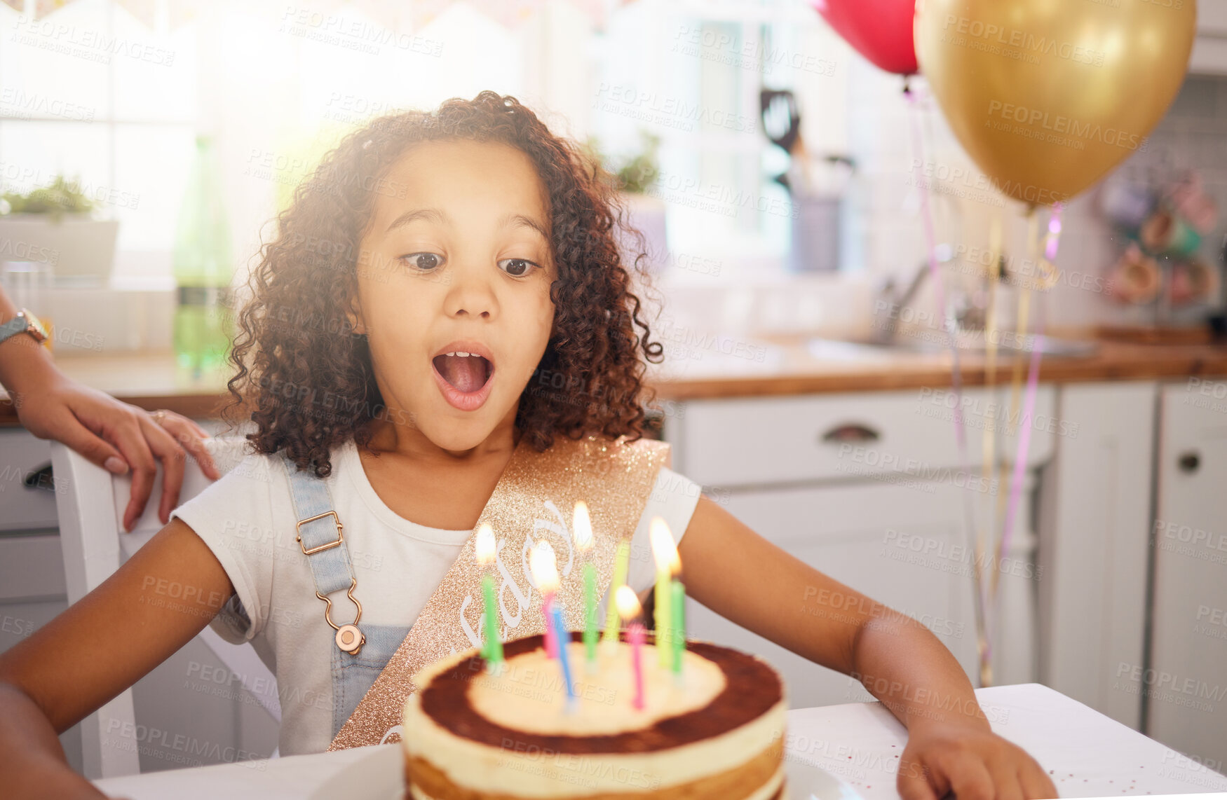 Buy stock photo Happy birthday cake, candles and child with surprise, excited and happy face for love, care and celebration. Party, balloons and celebrate with black girl kid and dessert at the kitchen house table