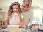 Family, learning and girl baking with grandmother in a kitchen, bonding while prepare cookies together. Teaching, independence and child development by senior woman showing child how to bake snack