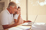 Elderly man, laptop and child on a video call speaking and waving while relaxing at home together. Happy, smile and grandfather and little girl greeting on a virtual call with a computer in the house