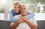 Happy senior couple in living room portrait with love, care and support hug in home living room. Dallas elderly or pension people relax on sofa together and happiness with life wellness or retirement