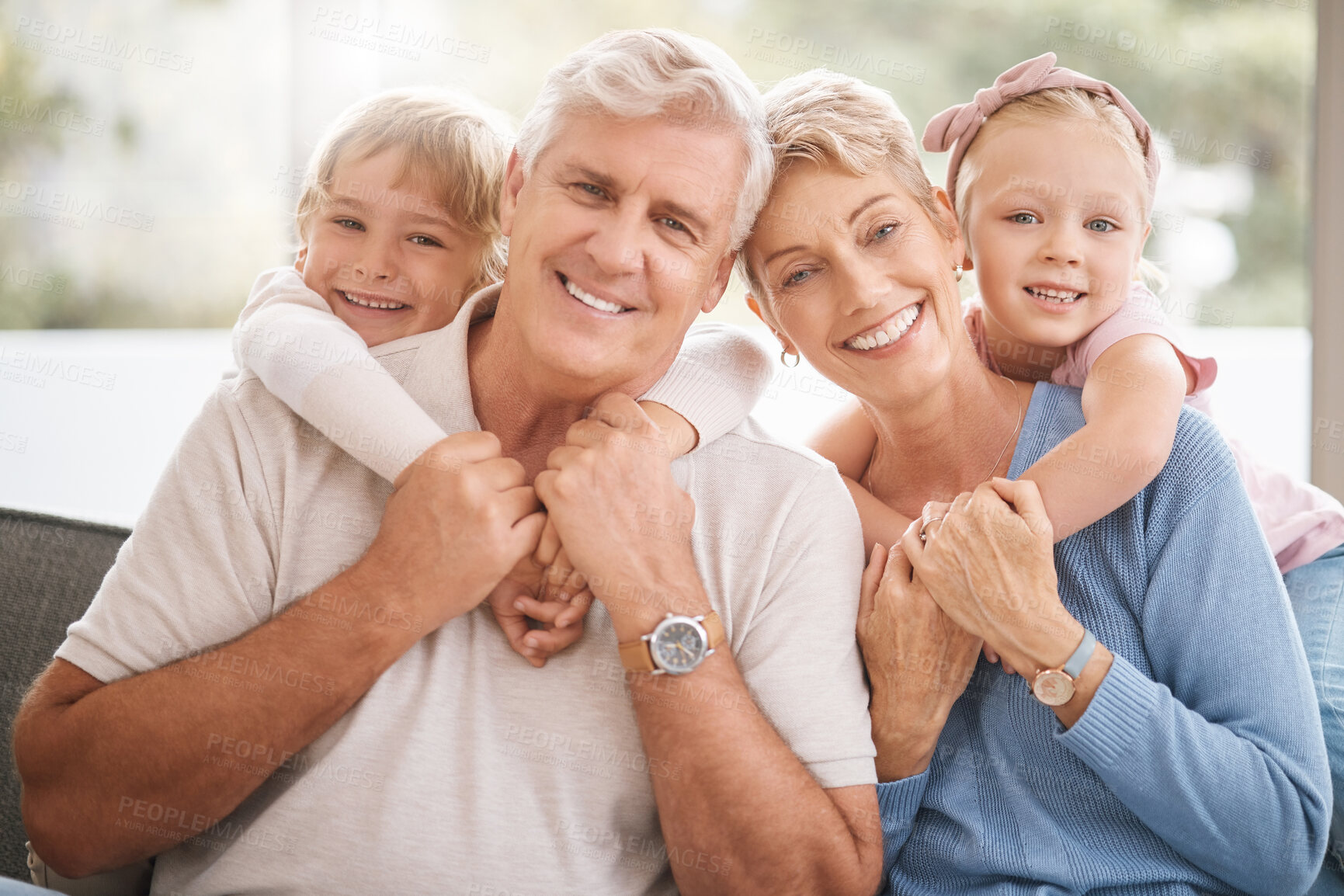 Buy stock photo Relax, smile and grandparents with children in living room for love, family and retirement together. Happy, peace and support with old man and woman hug with kids at home for portrait, lounge and joy