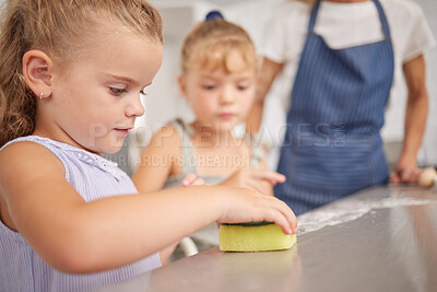 Buy stock photo Family, learning and children help with cleaning home, kitchen or house for child development, hygiene and clean surface. Helping, sponge and father teaching youth kids, girl or sisters life skill