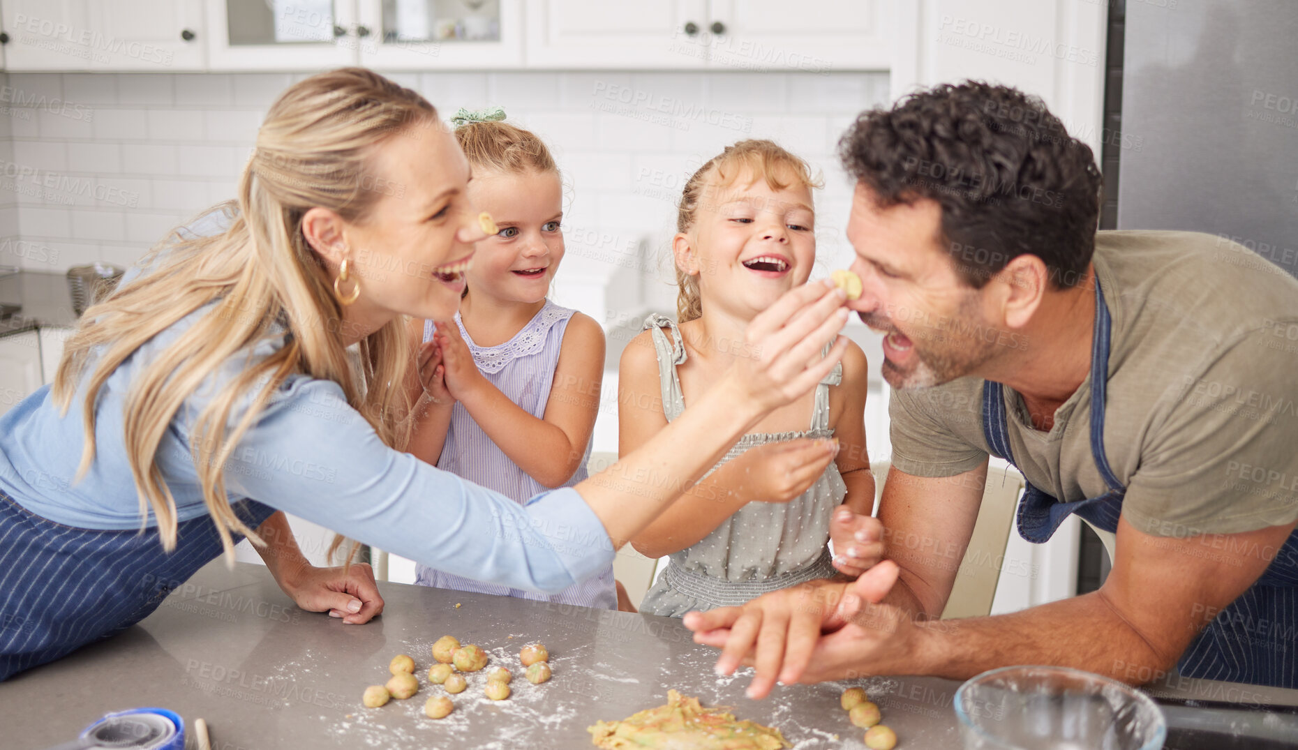 Buy stock photo Happy family play with food cookies in kitchen with funny parents and girl children for home learning together, love and holiday celebration. Mother, father or fun people baking or cooking with kids