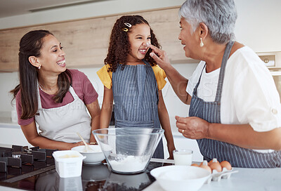 Buy stock photo Family baking, flour fun and grandmother teaching children to bake cake in the kitchen of their home. Happy girl, mom and senior person cooking together, learning about food and being playful