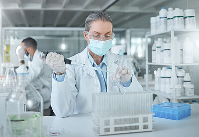 Buy stock photo Medical science, covid lab and scientist working on research for healthcare for a virus at work. Doctor in medicine with a face mask for security from chemical while planning a development for future