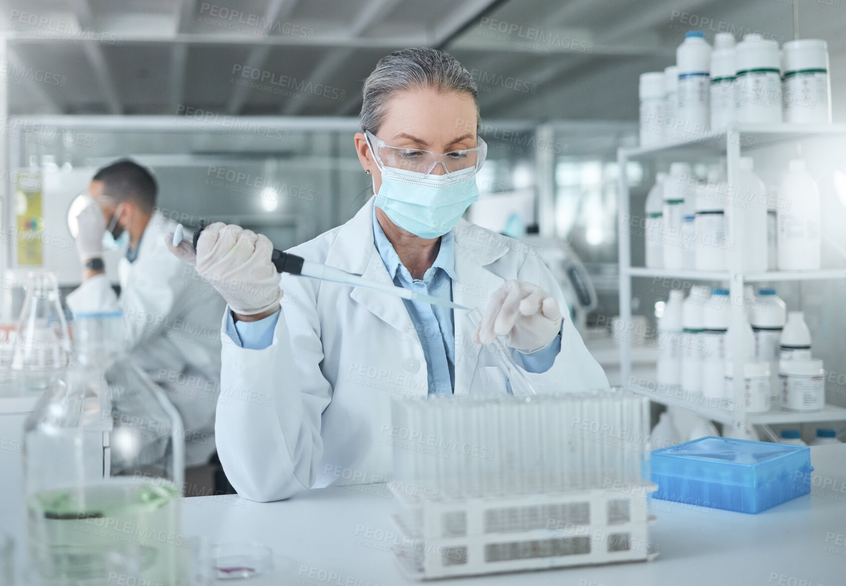 Buy stock photo Medical science, covid lab and scientist working on research for healthcare for a virus at work. Doctor in medicine with a face mask for security from chemical while planning a development for future