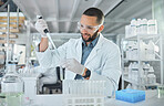 Scientist using test tube in lab for science, research and medicine. Portrait of man doing test in biotechnology, medical research and analytics in laboratory, testing a sample in healthcare clinic