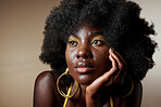 Black woman, makeup and afro thinking of idea with hair, beauty and fashion against brown backdrop. Model, skin and cosmetics contemplating dream, future and life against neutral studio background