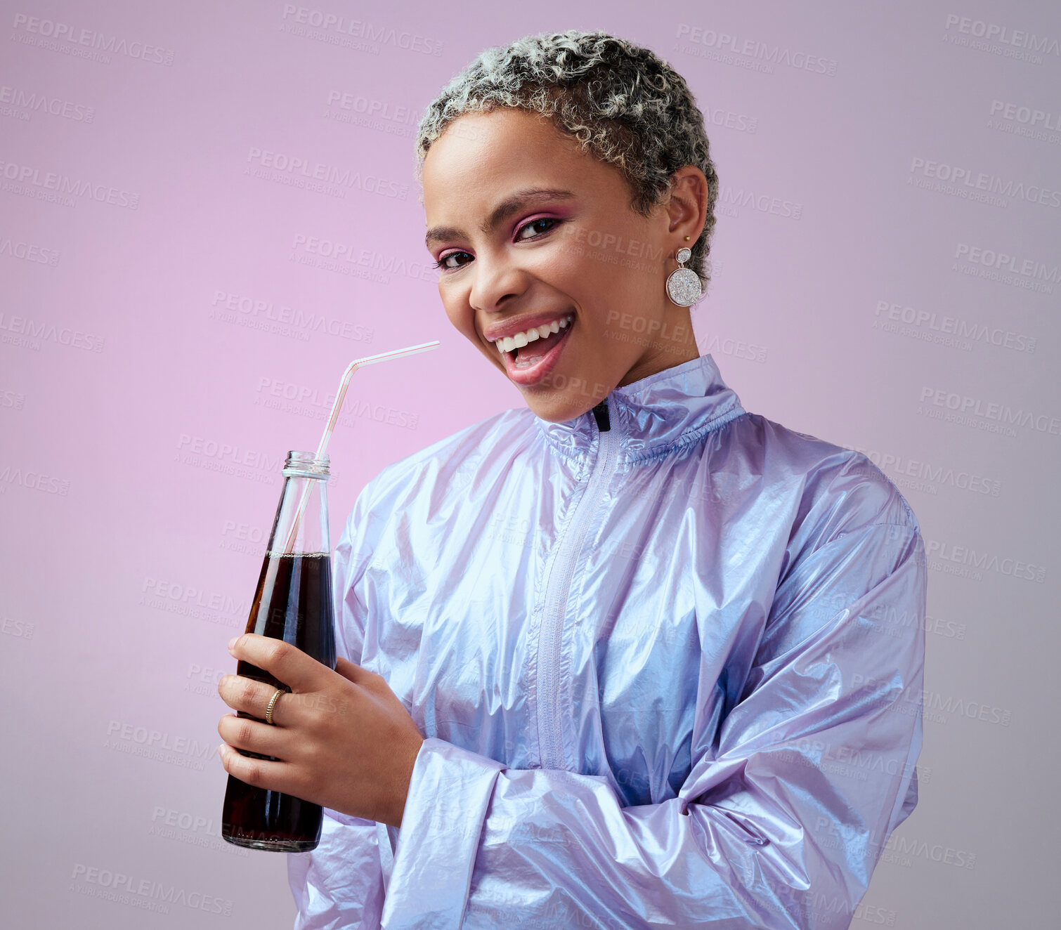 Buy stock photo Happy, excited and portrait of a black woman with a soda in a studio with a purple background. Stylish, fashion and young african model with a smile drinking a bottle of cola beverage with a straw.