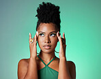 Beauty, black woman and green eyeshadow makeup with thinking and focused face with mockup. Beautiful, elegant and trendy African girl with cosmetics contemplating decision or idea in studio.