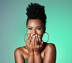 Beauty, green fashion and makeup with a black woman laughing in studio on a wall background. Portrait, happy and funny with an attractive female joking inside while her hands are on her face