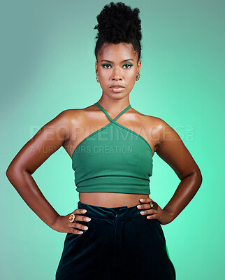 Buy stock photo Green fashion, beauty and makeup with a black woman hands on hips in studio on a wall background. Portrait, cosmetics and style with a young female posing for a contemporary style photo shoot