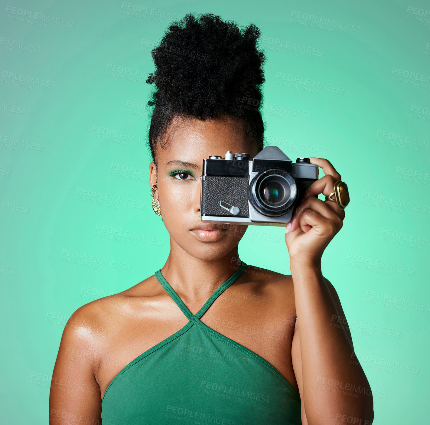 Buy stock photo Black woman, photographer or fashion model on green studio background in creative art, clothes brand or designer social media blog. Portrait, camera and digital photography person with cool hairstyle
