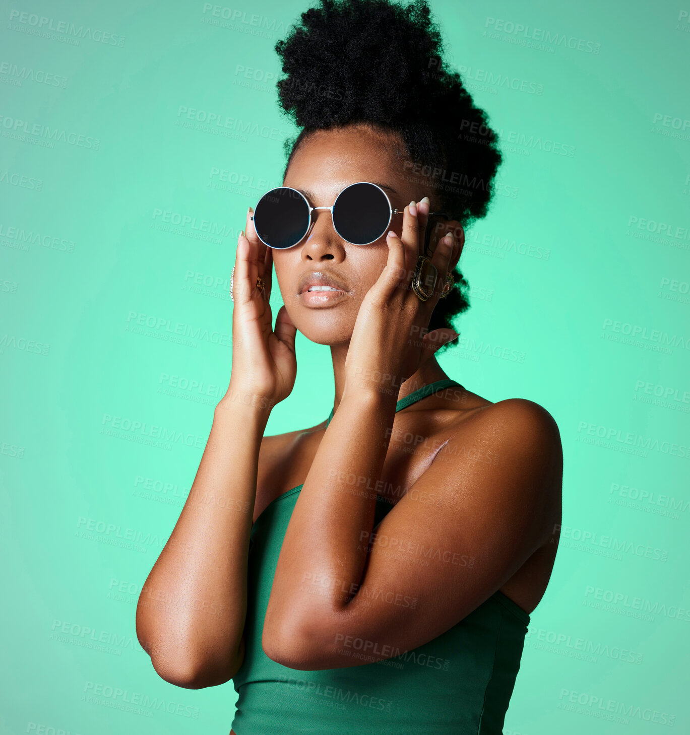 Buy stock photo Fashion, black woman and glasses with a model in studio on a green background with vintage or retro sunglasses or eyewear. Trendy, style and confident with a young african american female with afro