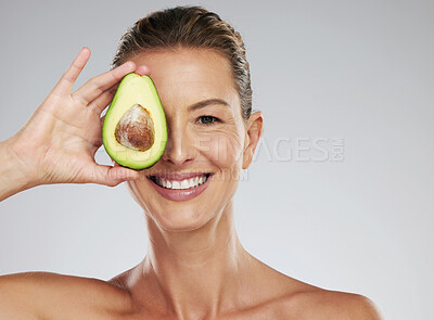 Buy stock photo Avocado skincare, woman beauty and natural cosmetics for facial mask, healthy diet and happy results on grey studio background. Portrait of mature model, organic anti aging dermatology and clean face