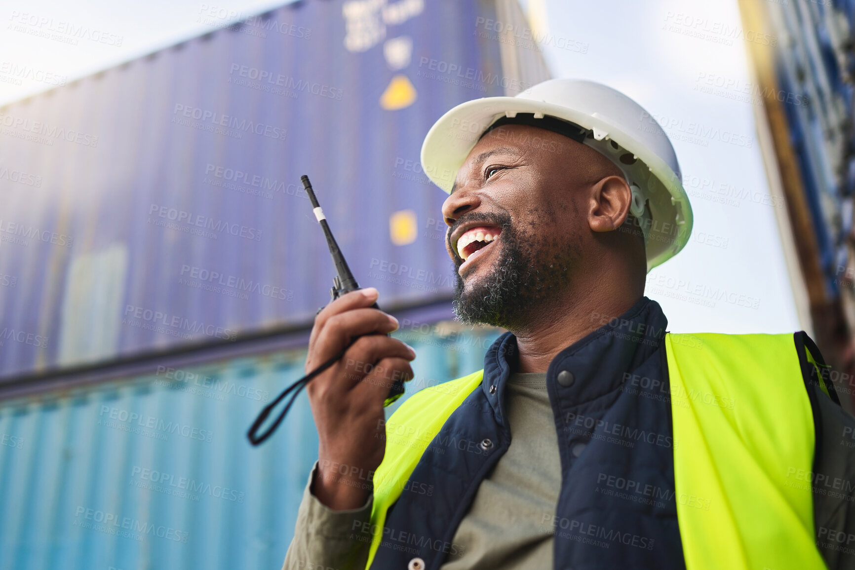 Buy stock photo Logistics, supply chain and radio with a man delivery worker talking on a walkie talkie while working in a container yard. Ecommerce, stock and cargo in the retail, shipping and export industry