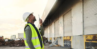 Buy stock photo Construction worker, engineer black man manager on site inspection for building, warehouse or industrial project development. Outdoor contractor businessman and walkie talkie communication management