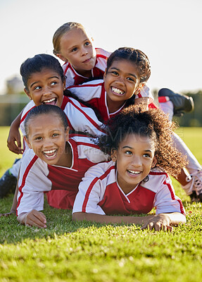 Buy stock photo Team, children and happy on field in sports after win in match, game or competition. Girl, smile and together after teamwork in soccer, football or sport on grass for motivation, diversity and unity