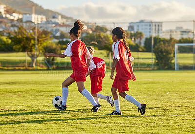Buy stock photo Football, competition and soccer athlete or teen group play game, training and practice on grass. Girl with a ball running, fitness and exercise on a sports club field with a team of young people