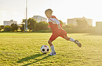 Soccer, football and sports girl training on field preparing for match, game or competition on outdoors grass pitch. Health, fitness and kid kick ball learning sport for wellness, running or exercise