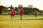 Sports, fitness and soccer training by girl team playing on grass field, teamwork during football game. Health, exercise and children learning to play in competitive match with energy and soccer ball