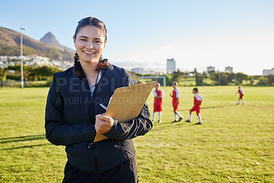 Buy stock photo Football coach, junior sports and woman with clipboard coaching children on a soccer field or pitch outside on a sunny day. Happy female pe trainer outside for practice, training and exercise class
