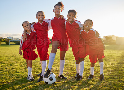 Buy stock photo Soccer, team sports and portrait of children training for football game on a grass field together. Happy, smile and young group of girl athletes in partnership and teamwork for sport match at school