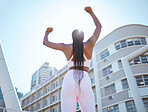 Black woman, success and hands up with fitness goals, exercise target and training in New York city. Low angle, sports winner and runner motivation after running workout, marathon and health wellness