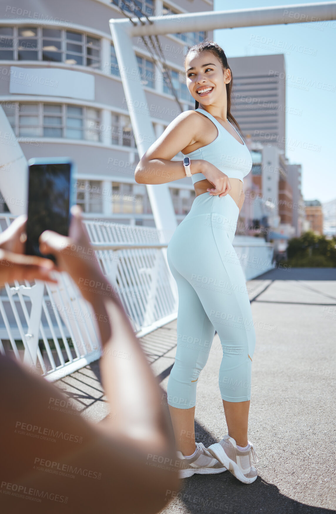 Buy stock photo Fitness woman, slim body and picture for a social media post with fit influencer outside for exercise, training and run outside on a city bridge. Happy latino female satisfied with weightloss workout
