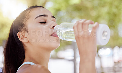 Woman, water bottle and drinking after fitness workout, training and exercise in nature park, garden or Mexico environment. Zoom, face and head of sports person or personal trainer on wellness break