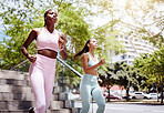 Fitness friends, city running and women exercise together for healthy lifestyle, wellness and marathon training in urban outdoors. Focus athletes, runners and cardio challenge for powerful motivation