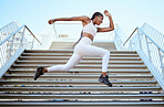 Energy, running and black woman runner on steps for outdoor fitness training, wellness exercise or sports speed challenge. Strong, healthy power and african athlete run fast for fashion summer body