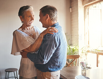 Buy stock photo Dance, freedom and retirement with senior couple dancing in celebration, having fun and bonding in living room. Fun, romance and active seniors sharing a funny joke and enjoying retired lifestyle