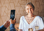 Smile, phone and photograph, senior woman on lunch date in cafe with with champagne. Smartphone, picture on screen and a happy elderly couple in love on romantic anniversary celebration in restaurant