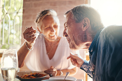 Buy stock photo Couple, love and food with a senior man and woman on a date in a restaurant while eating on holiday. Travel, romance and dating with an elderly male and female pensioner enjoying a meal together