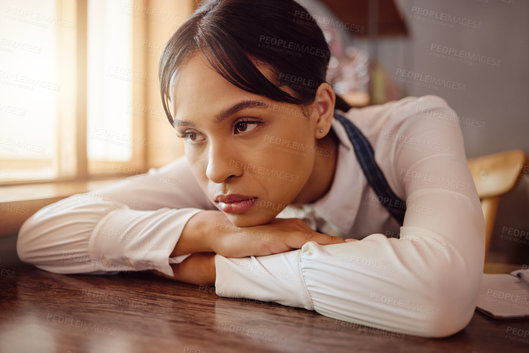 Buy stock photo Sad waiter in Paris cafe, woman tired at table in bistro and hospitality service industry job. Disappointed face in small business, bored fatigue at restaurant and mental health depression at work