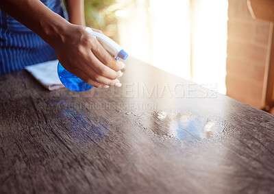 Buy stock photo Cleaner, hand and spray cleaning table with sanitizer in home, office or restaurant. Waitress, waiter and bottle with chemical to clean dirt, bacteria or covid 19 in cafe, house or coffee shop