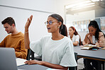 Diversity at university, where students are learning education through question asking in lecture. Young woman in classroom, asking with hand up while classmate listen. 