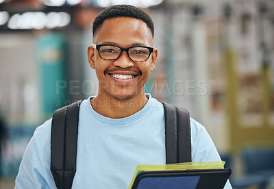 Buy stock photo Black student, education and man with smile in library, college or university with books for homework assignment. Happy African american male with glasses at campus to study, learn and gain knowledge