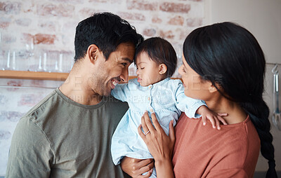 Buy stock photo Happy family, down syndrome baby and love in home, bonding and caring for infant child. Support, care and parents, father and mother spending time together with newborn girl with disability in house.